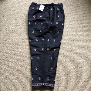 Black embroidered silk pants. 14p